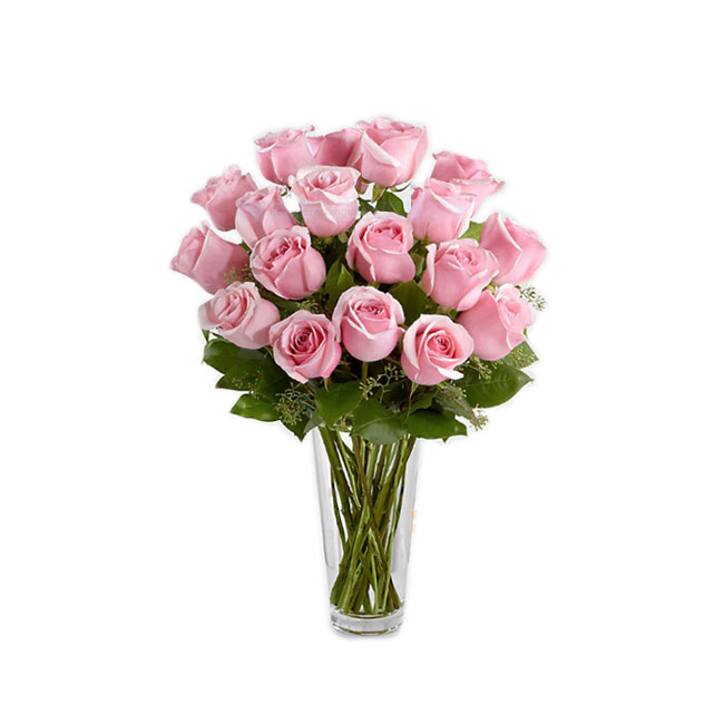 Florero de vidrio con rosas rosadas